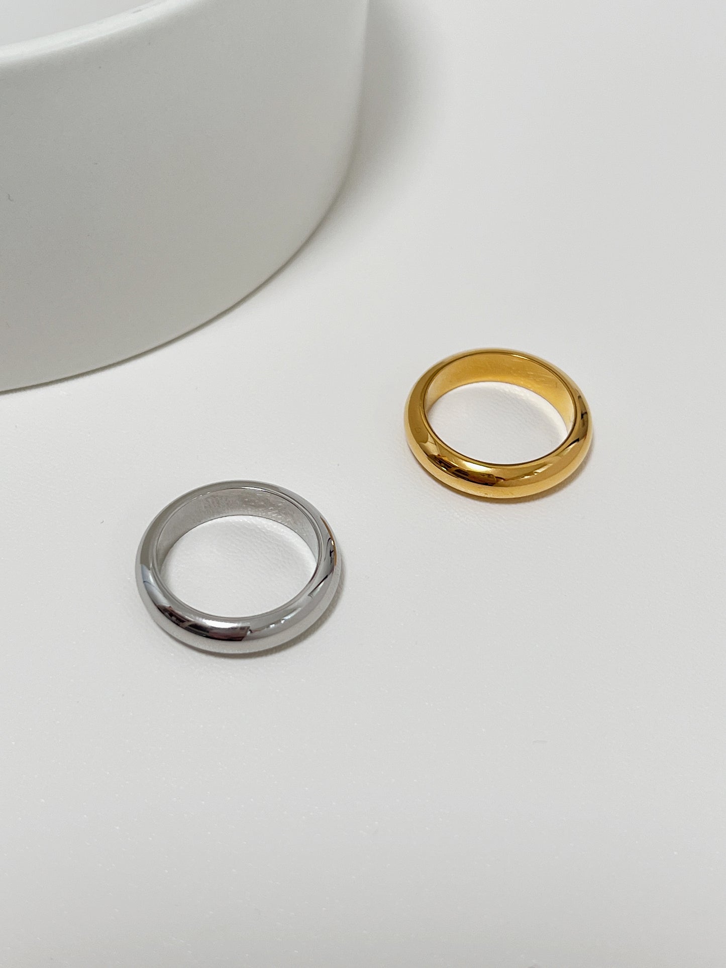 Low profile delicate band rings crafted with a solid surgical grade core