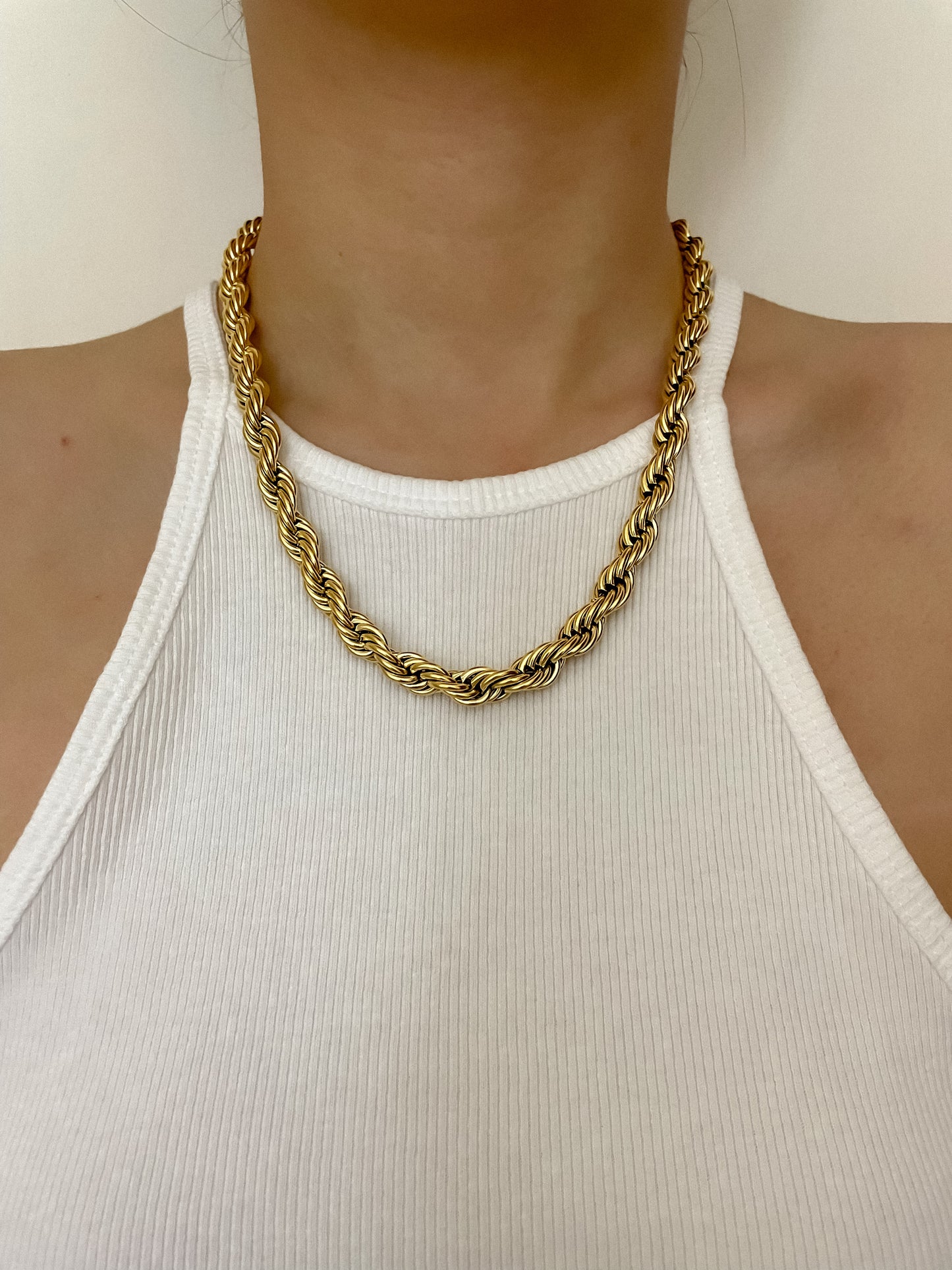 Gold rope chain necklace worn with white tank top, high-quality jewelry for everyday wear