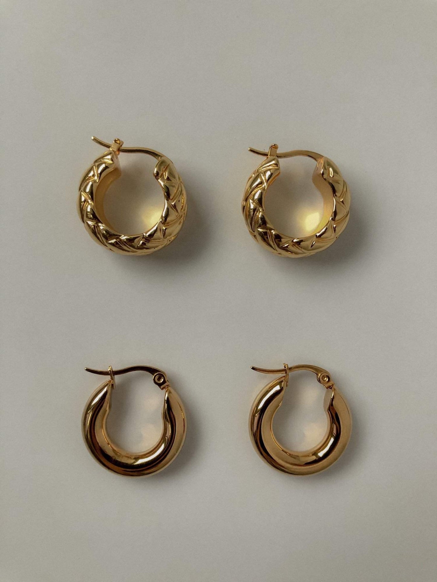 Gold hoop earrings for women with a beautiful braided design and basic plain design