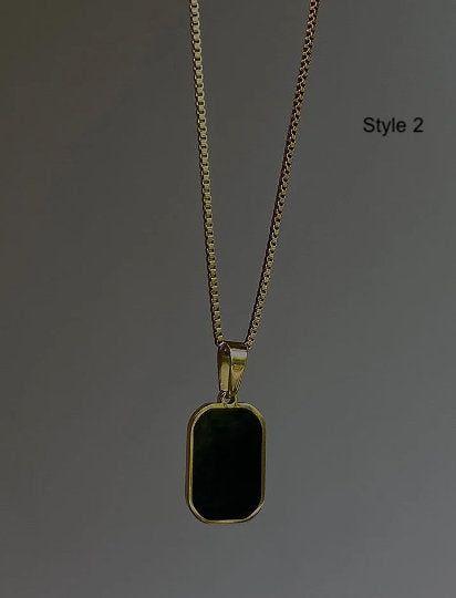 stylish gold chain necklace with a black rectangular charm