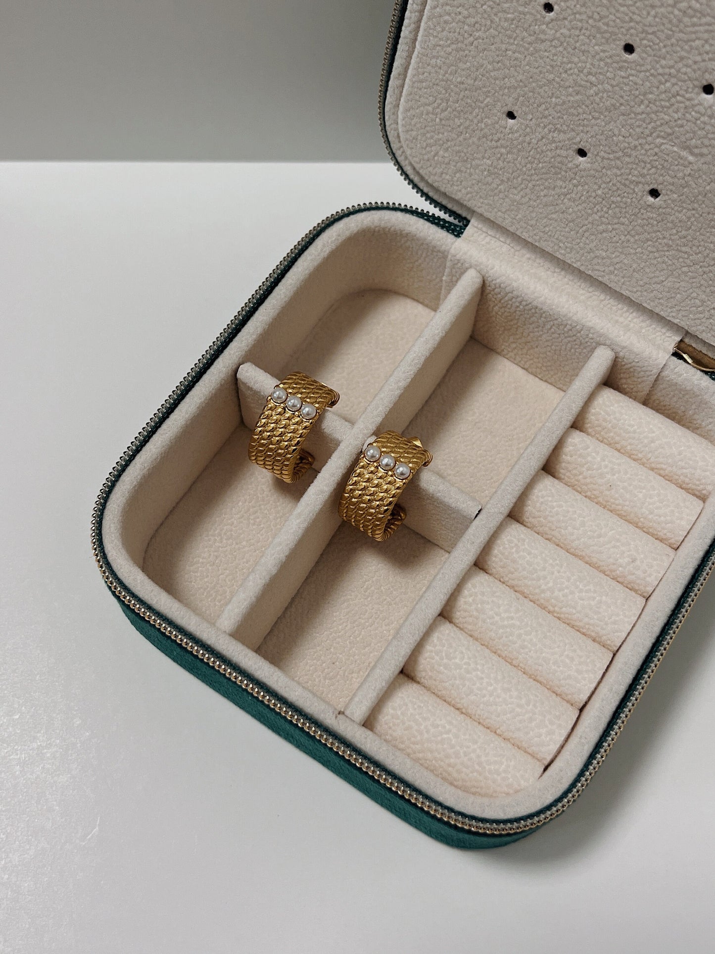 Fashionable gold hoop earrings with pearl accents, ideal for elegant evening wear