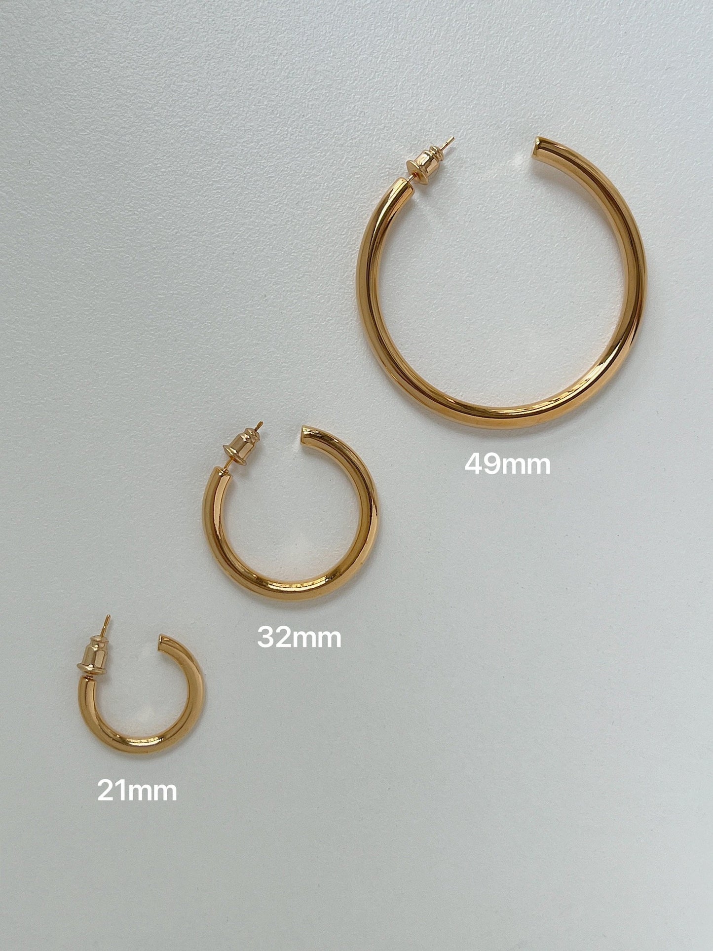 Timeless gold hoop earrings set, versatile design, perfect gift for women.