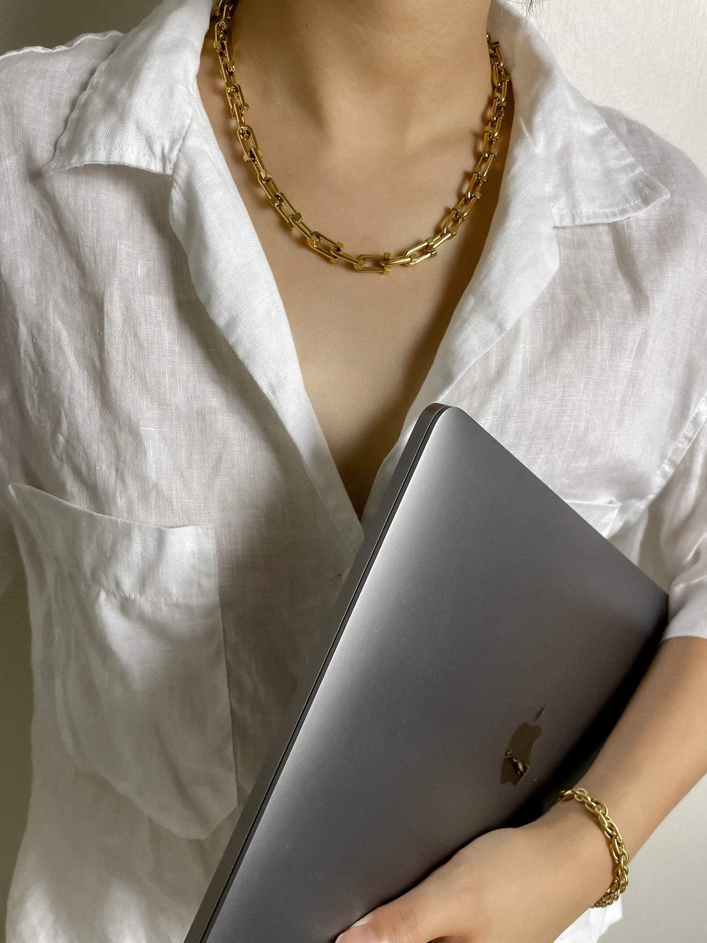Casual work look featuring a heavy gold PVD steel chain styling