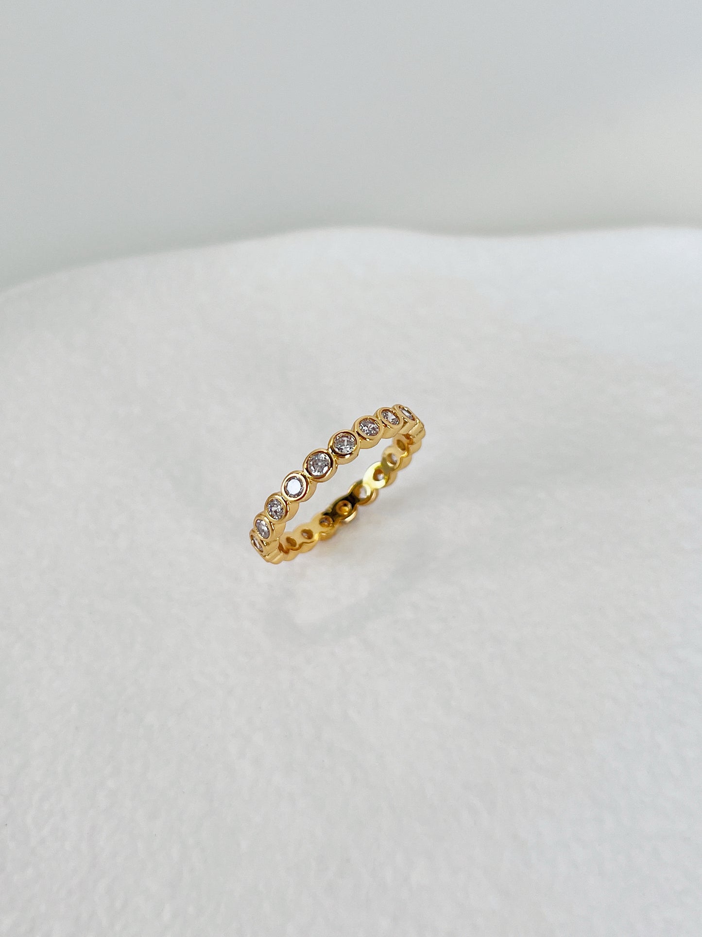 Sleek round cut 5A cubic zirconia full bezel setting eternity band