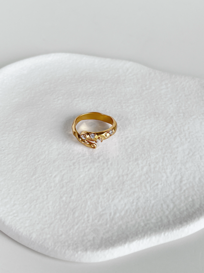 Gold hammered bypass ring with 5a grade cubic zirconia stone detail