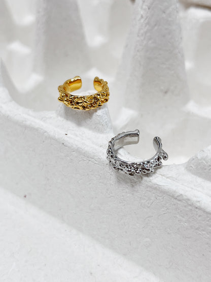 Side profile of the Molten Ridge 18k gold PVD ear cuff highlighting its wide-band design.