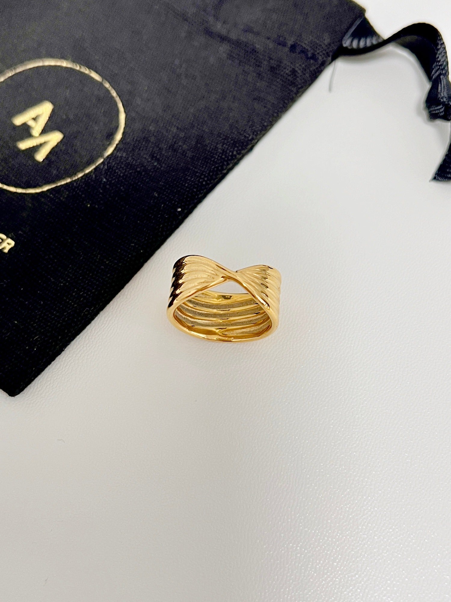 316L surgical stainless steel crossover ring with a thick yellow gold finish