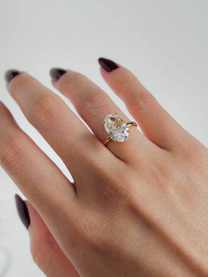 Minimalist everyday styling with a 3ct oval diamond alternative ring