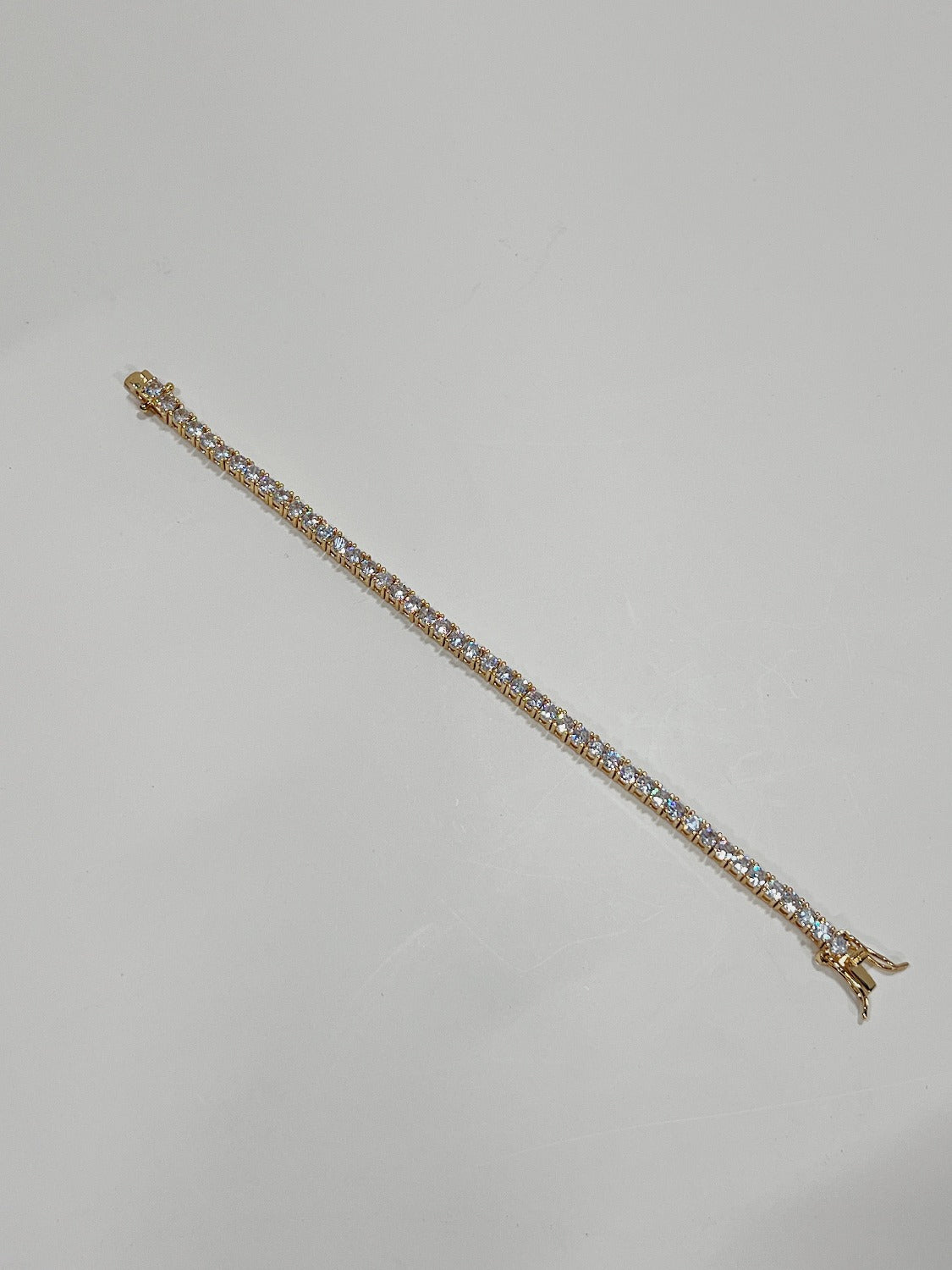 Gold tennis bracelet with diamonds, perfect for anniversaries