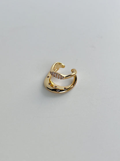 Close-up of wavy liquid-metal band on the Ashley Gold Cuff.