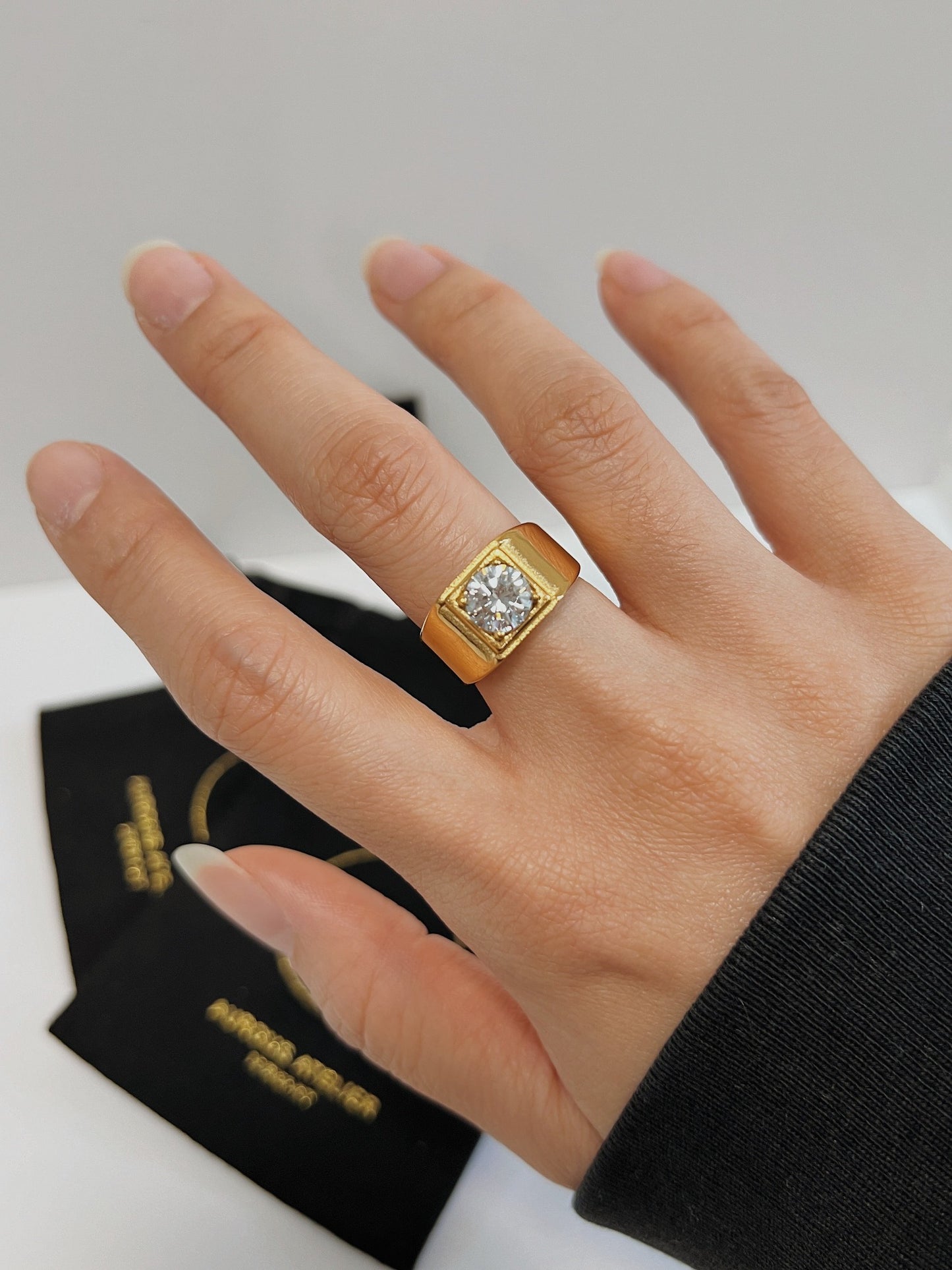 Model wearing the Thick Kass Ring on the middle finger for a bold look.