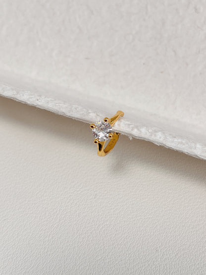 Side profile of minimalist gold ear cuff design.