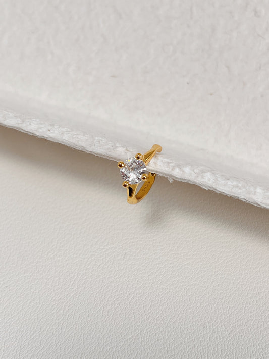 Side profile of minimalist gold ear cuff design.