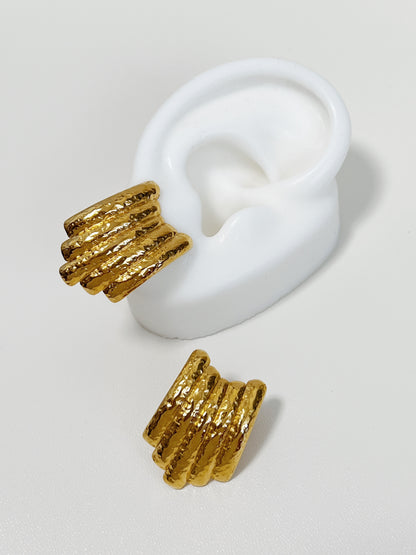 Trendy gold hammered texture earrings with a unique ribbed design.