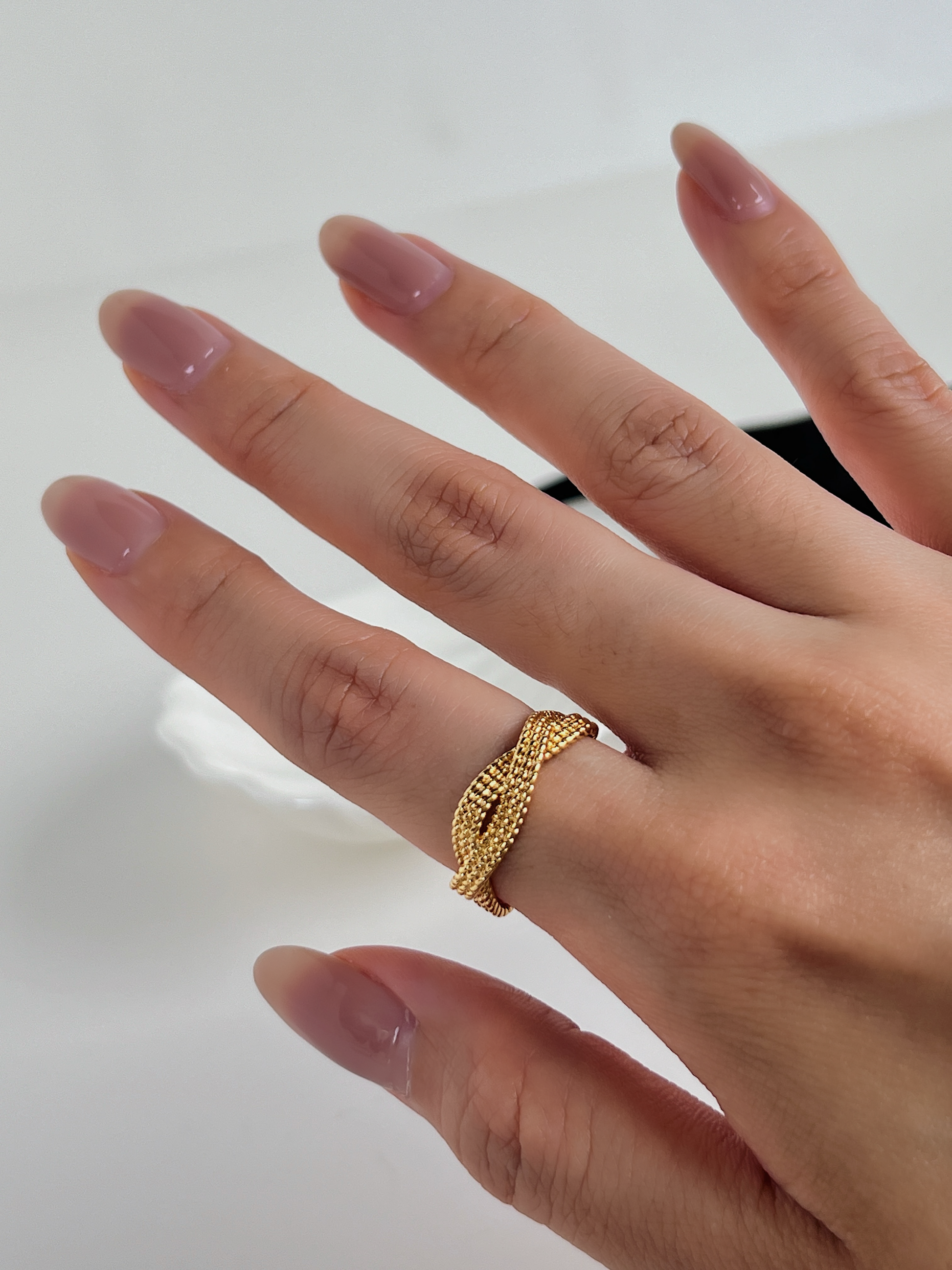 Exquisite gold ring with a detailed and elegant rope twist.