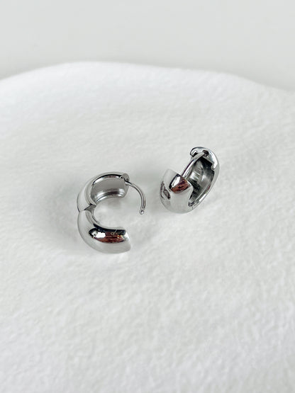 Close-up of Amie Silver Chunky Hoops showing high-polish finish.