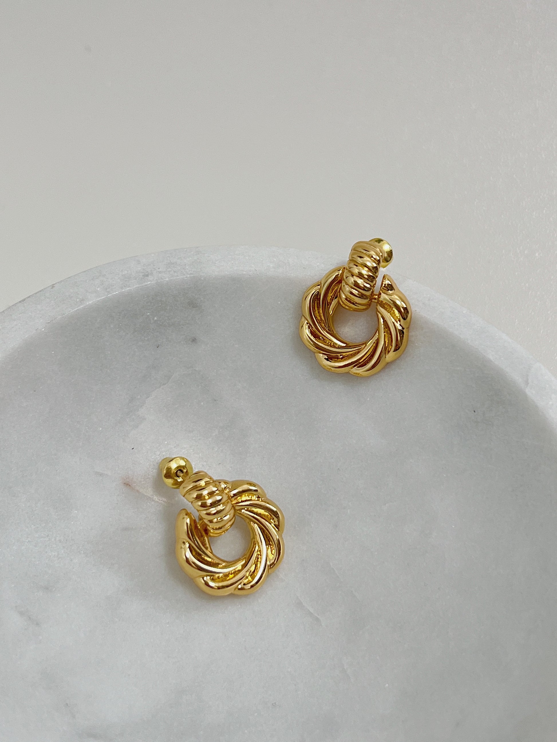 Minimalist 18k gold plated brass mini knot earrings, adding a touch of glamour to your outfit.