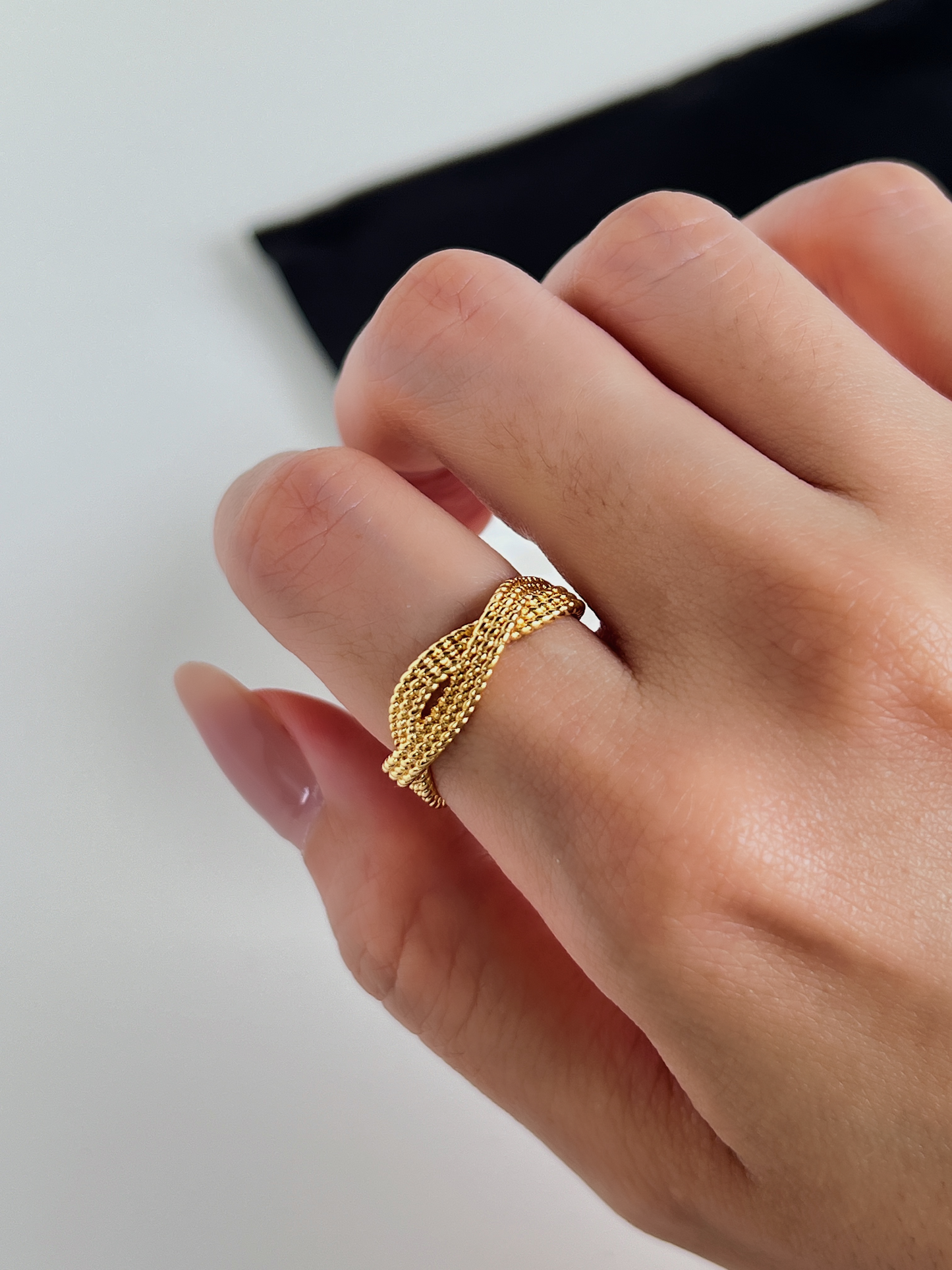 Premium gold ring showcasing a unique twisted rope design.