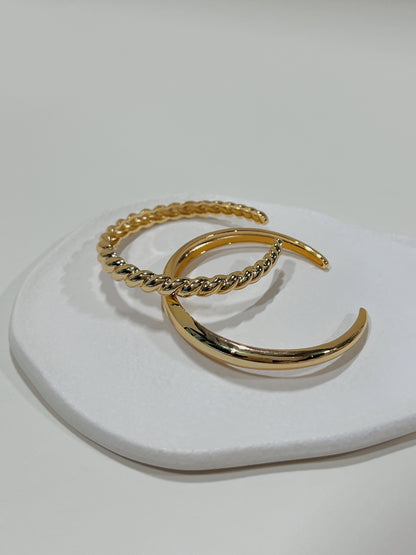 Close-up of the smooth inner bands and slightly adjustable open-gap frame of our premium gold plated cuff bangles.