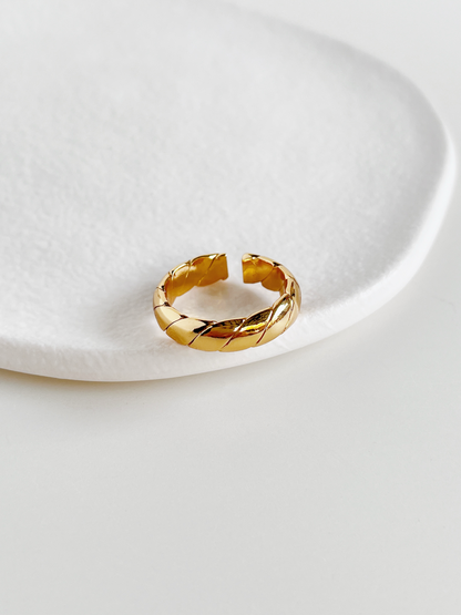 Adjustable open back gold ring showing smooth interior comfort fit construction