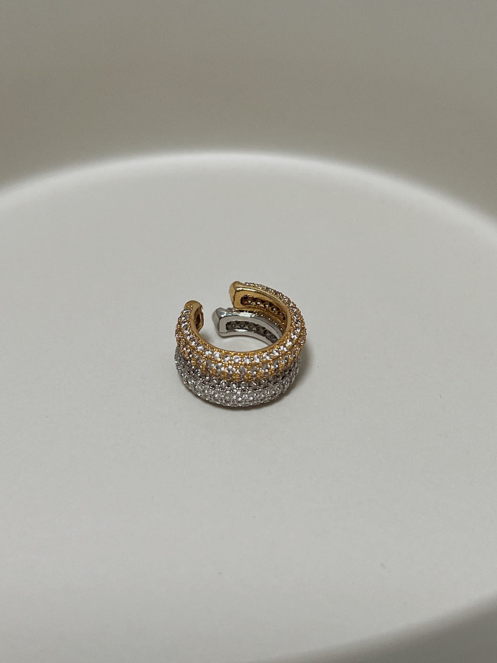 Close-up of 5a cubic zirconia quad-row pavé ear cuff.