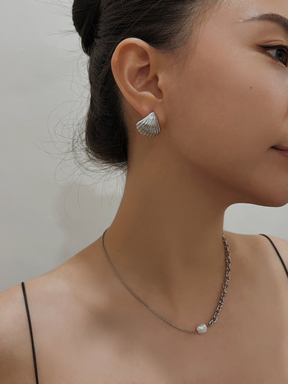 Close up shot of model featuring non-pierced Ariel gold shell stud and pearl chain necklace