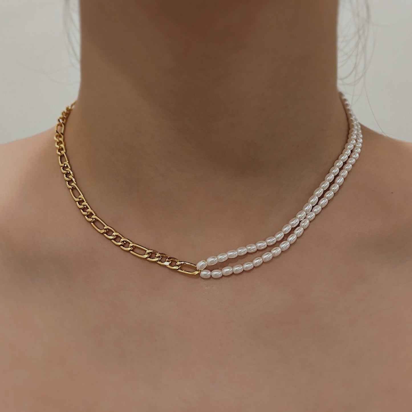 Close up of 18k gold PVD water resistant Italian figaro link chain texture