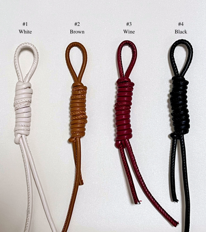 Four leather straps in different colors for personalized option.
