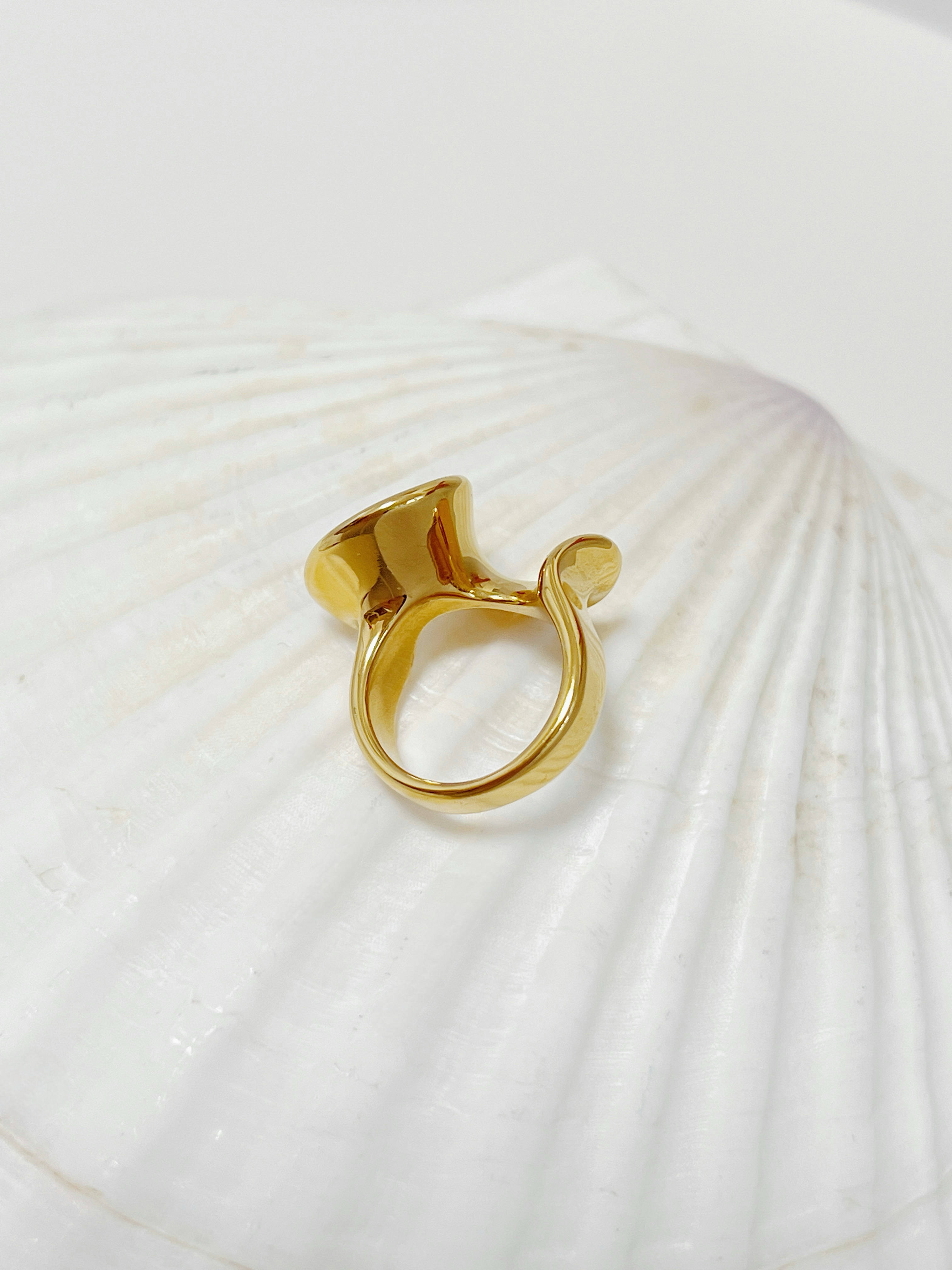 Tarnish-free 18k gold-plated stainless steel wave band on white display