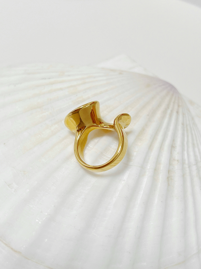 Tarnish-free 18k gold-plated stainless steel wave band on white display