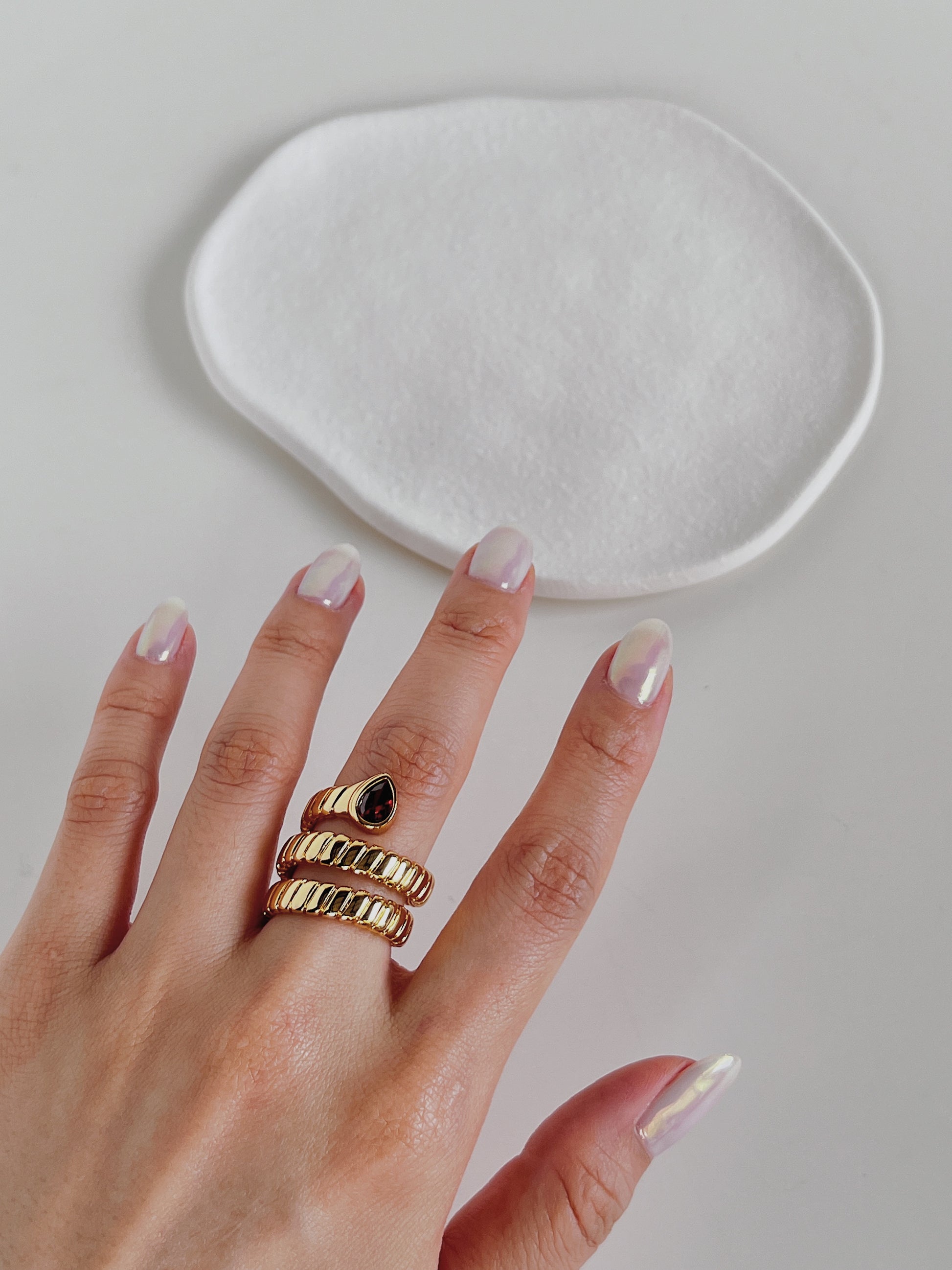 Aurous Atelier model wearing a skin safe tarnish proof gold band