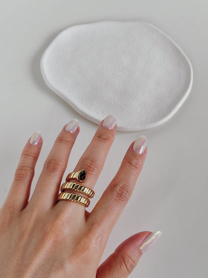 Aurous Atelier model wearing a skin safe tarnish proof gold band