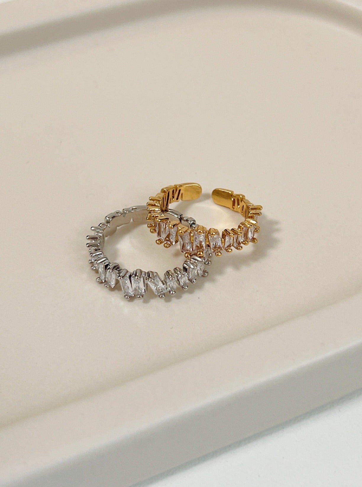 Lizza eternity baguette ring featuring staggered 5A cubic zirconia stones