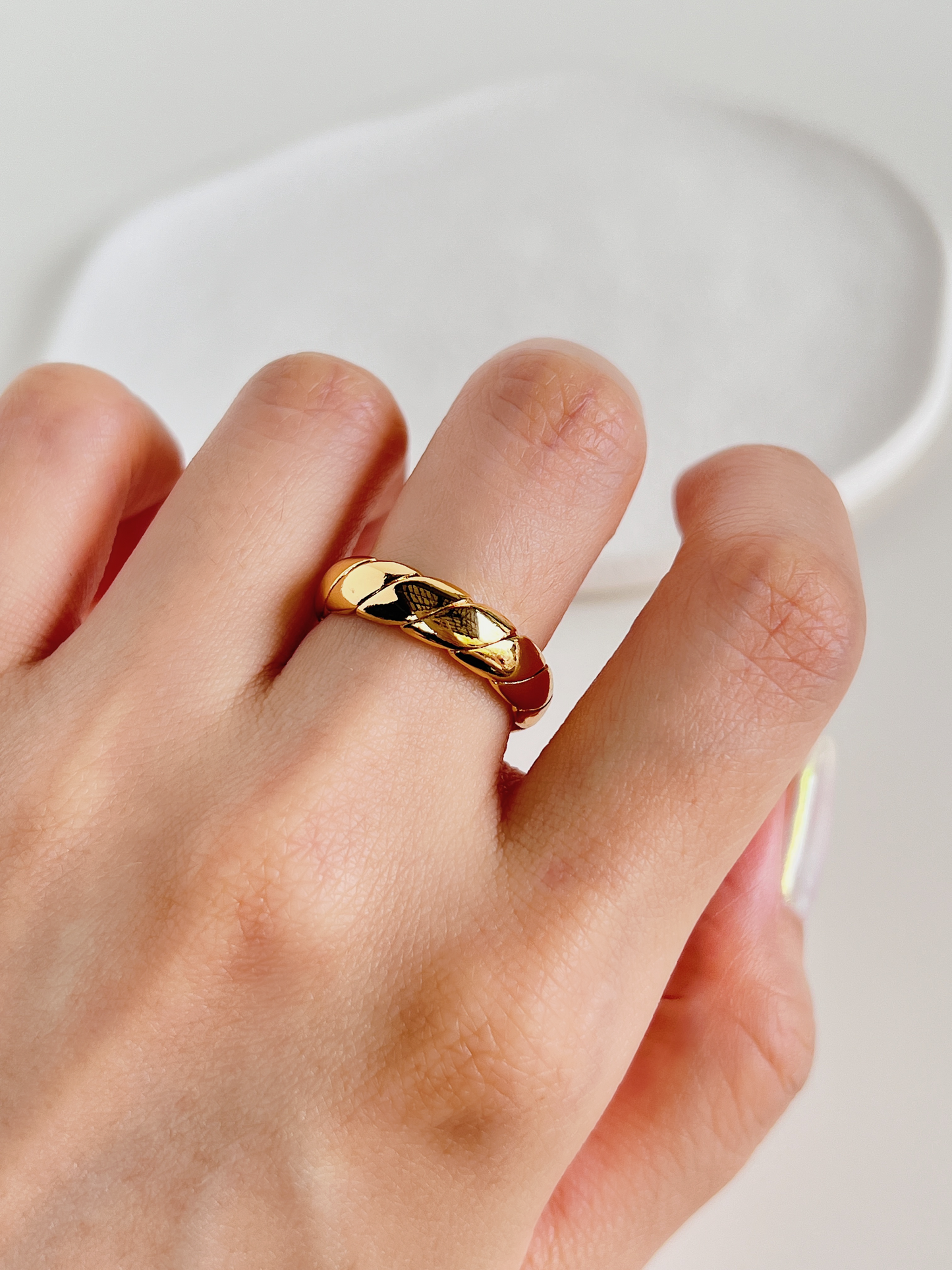 Close up image of a the high gloss gold rings catching the sunlight