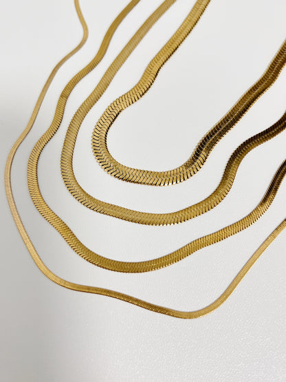 Hypoallergenic luxury capsule jewelry showcasing individual 2mm to 5mm gold snake chain choices