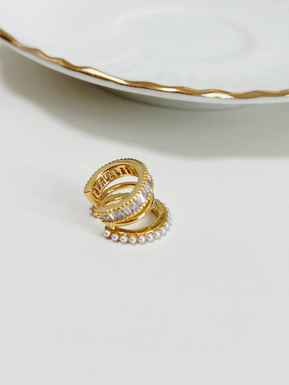 Luxe Triple Ear Cuff on a white surface showing high-polish finish.