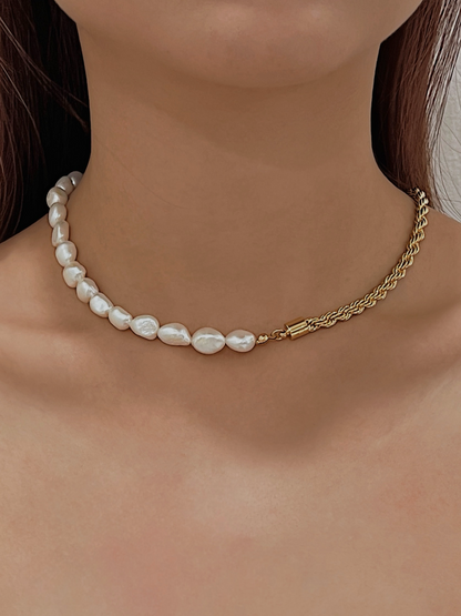 Woman skin close up showcasing modern split strand pearl jewelry resting on bare neckline