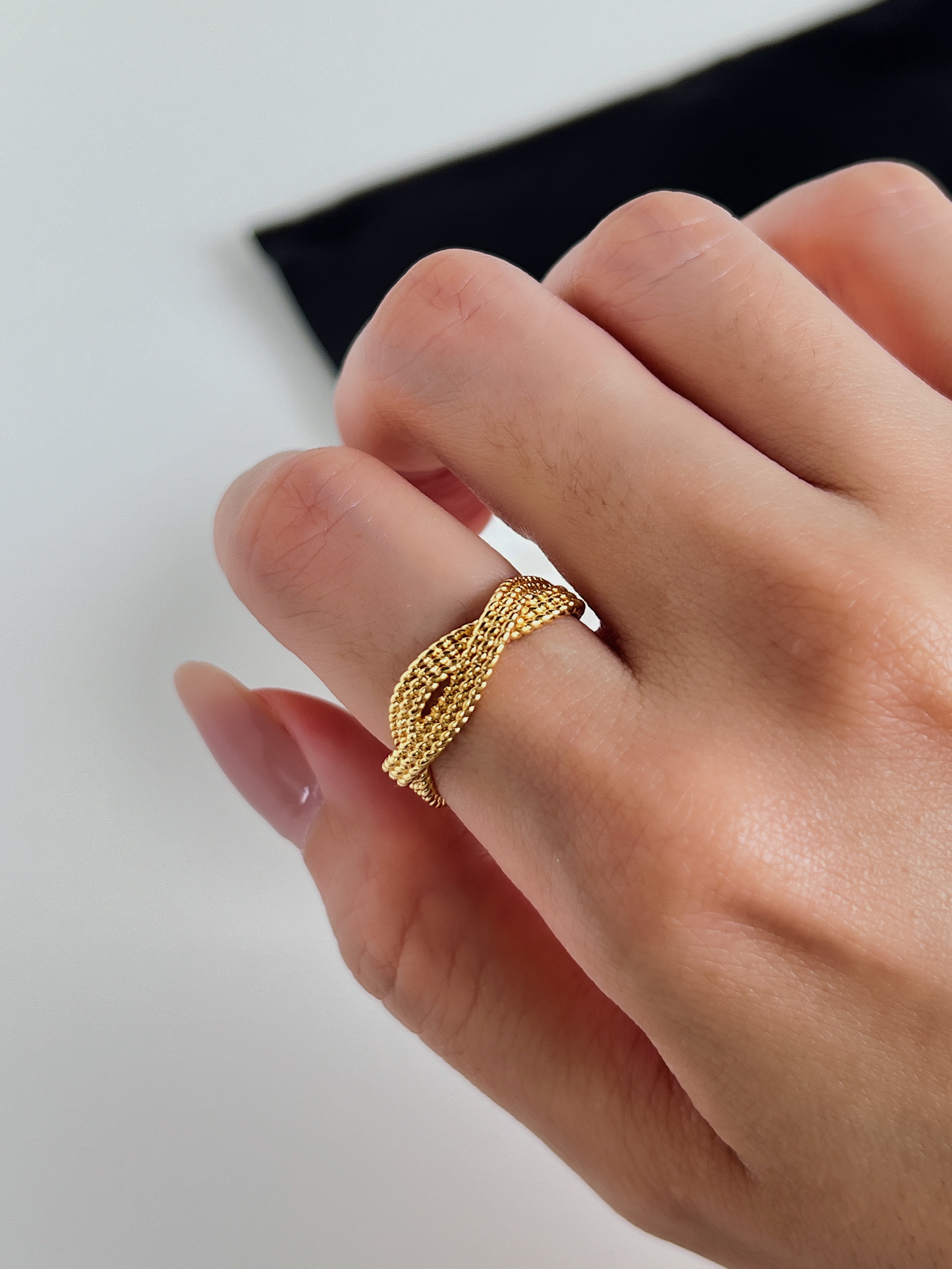 Minimalist everyday jewellery styling with a matte gold braided ring London