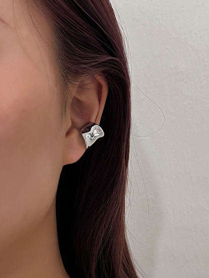 Model showcasing Kelly wide cuff with minimalist slicked-back hair.