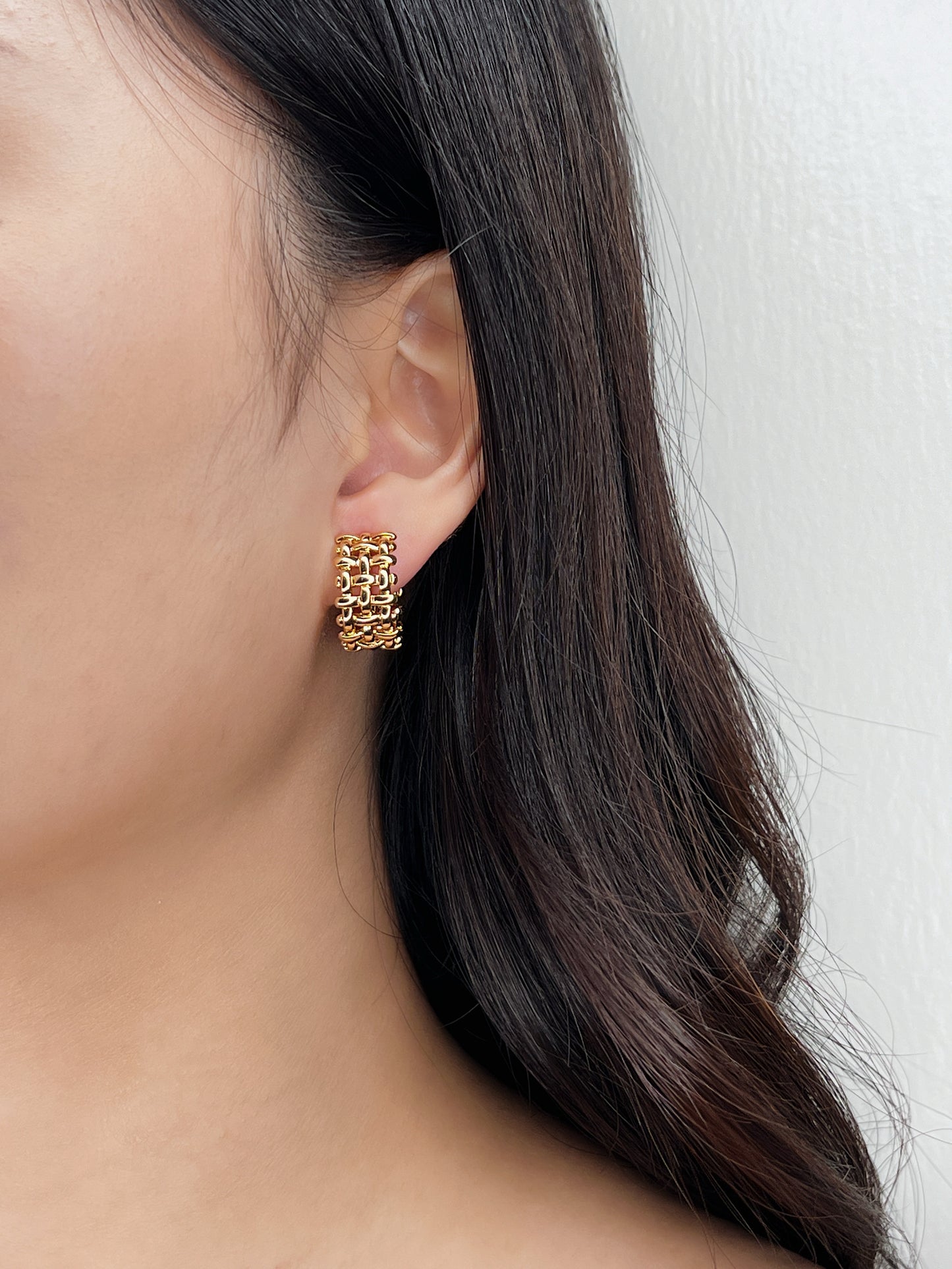 Model showcasing Mylie hoops with minimalist aesthetic.