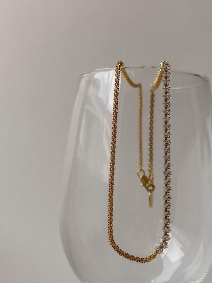 Fine jewelry alternative small batch construction highlighting marquise stone and gold strand