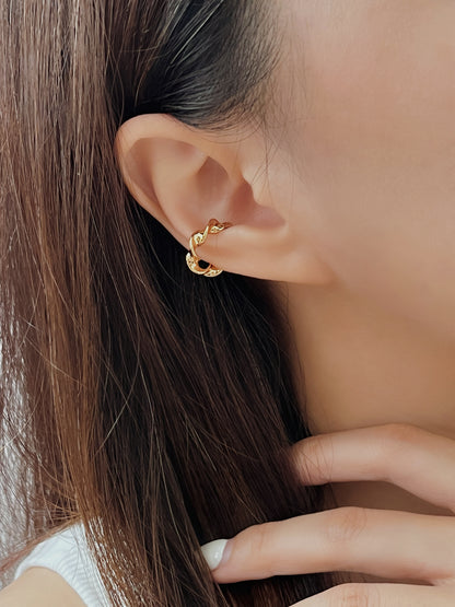 Close-up of ear stack styling with Mindy gold cuff.