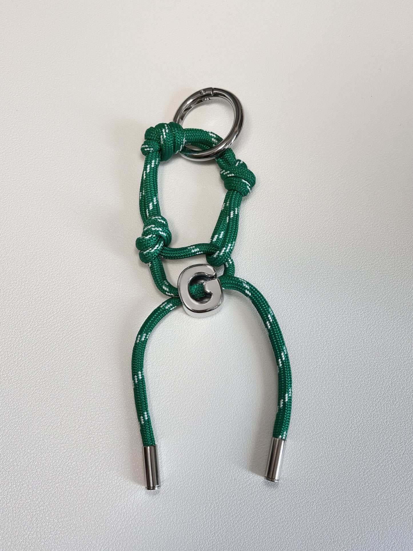High strength technical cord bow featuring secure heavy metal column aglets on a clean white background