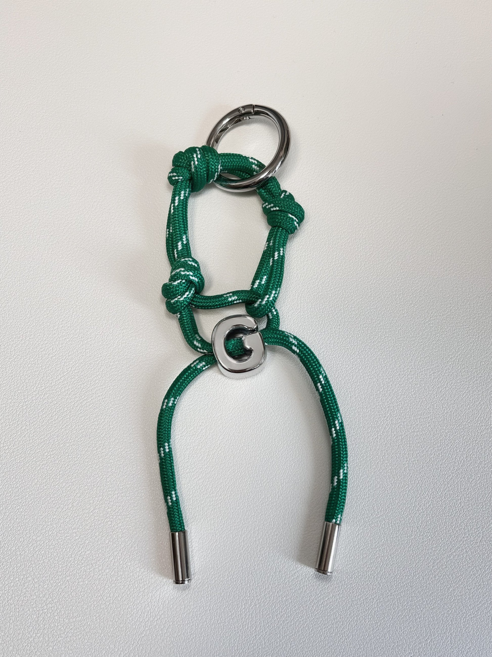 High strength technical cord bow featuring secure heavy metal column aglets on a clean white background