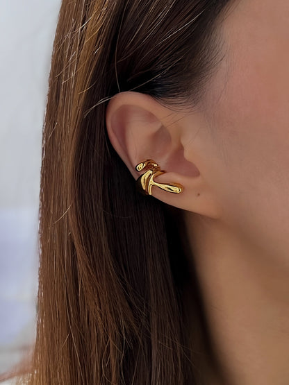 Model showcasing the high-shine molten gold texture in natural sunlight.