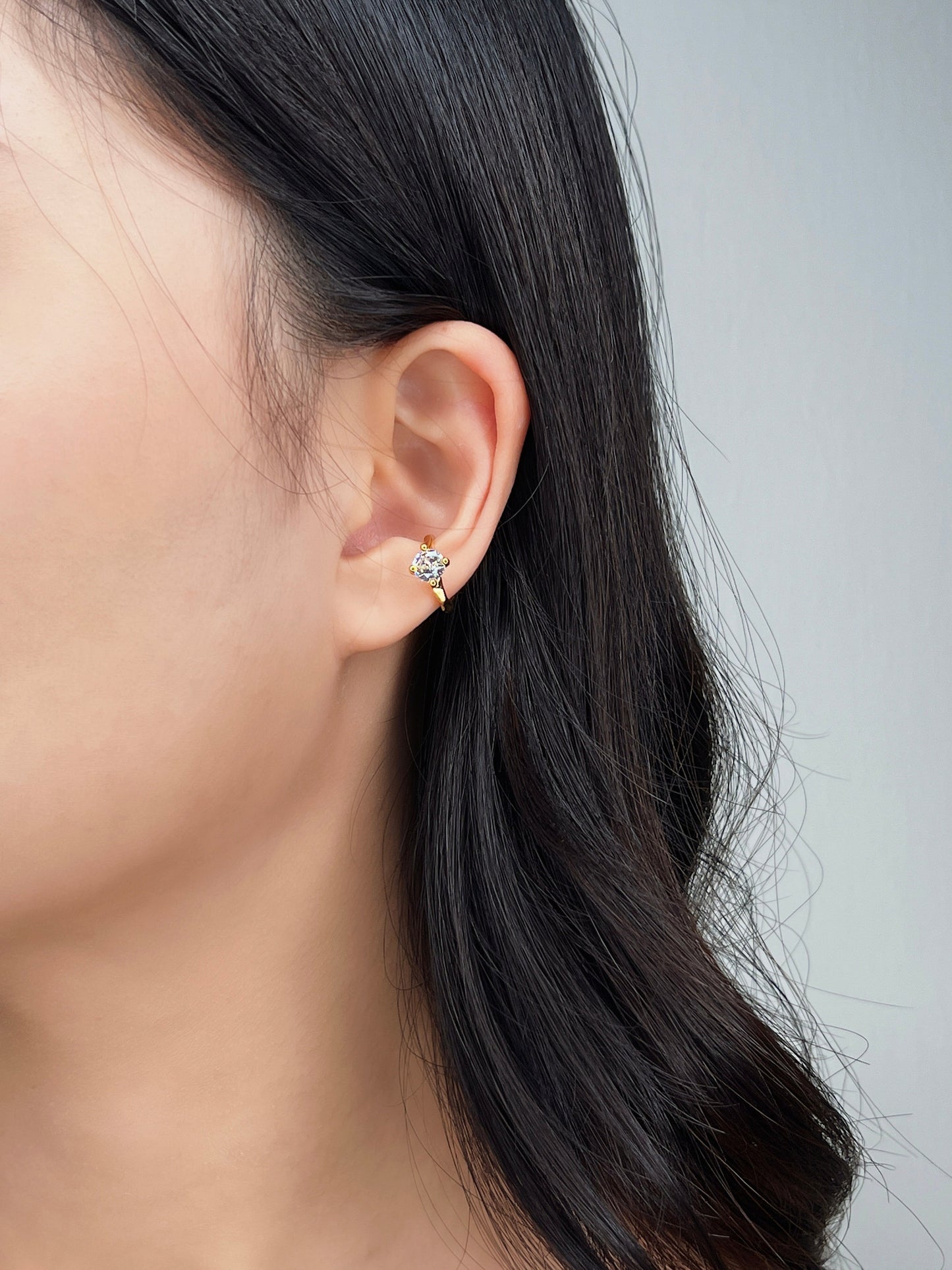 Model wearing dainty cuff, modern chic look.