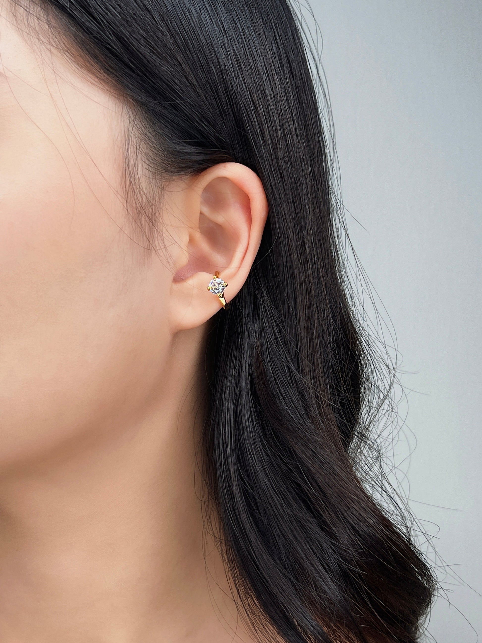 Model wearing dainty cuff, modern chic look.