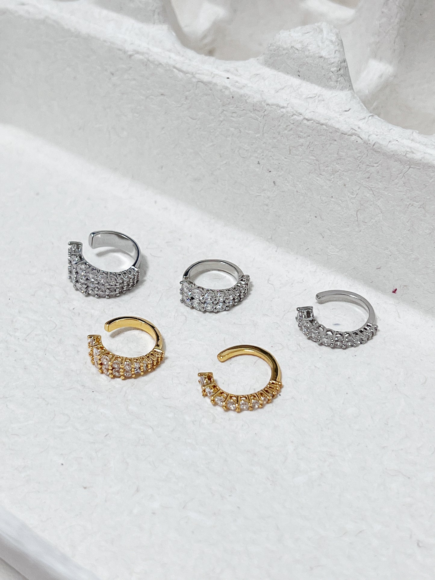 Group shot of Emily Pavé Cuffs on minimalist background