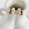 Evadne Sculptural Pearl Crossover Earrings