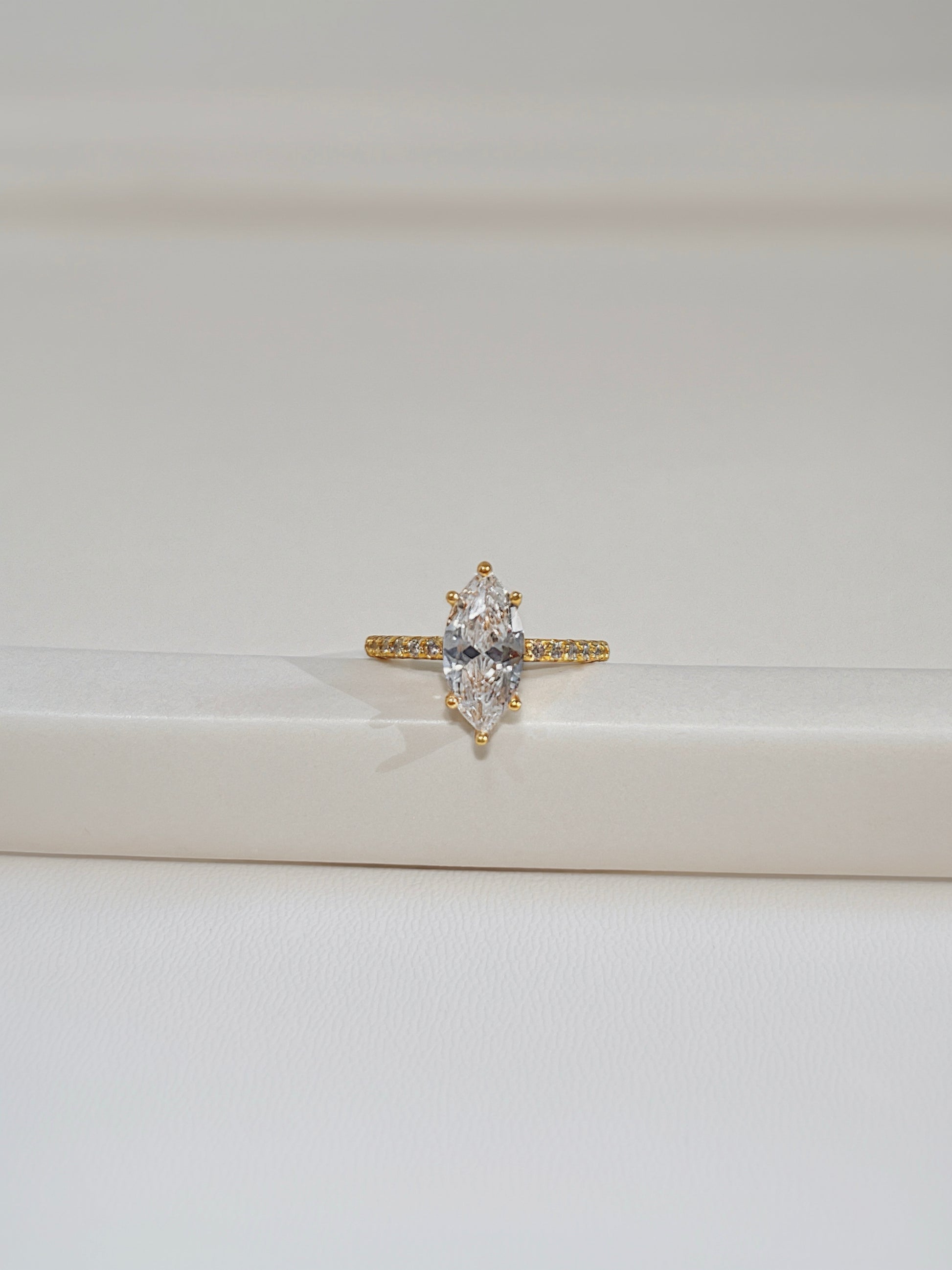 Kinn ring in natural light showing the fire of the 2ct moissanite stone.